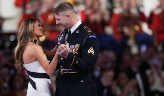 First lady Melanie Trump, left, dances with Army Sgt. Henry Waller during the Commander in Chief Ball on Monday.