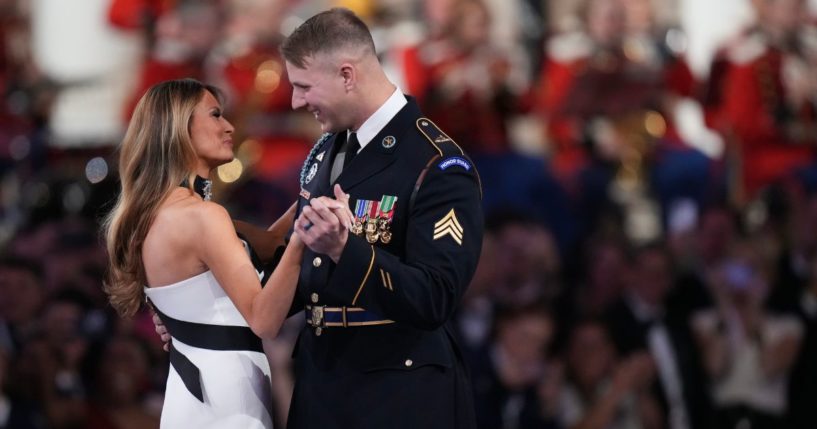 First lady Melanie Trump, left, dances with Army Sgt. Henry Waller during the Commander in Chief Ball on Monday.