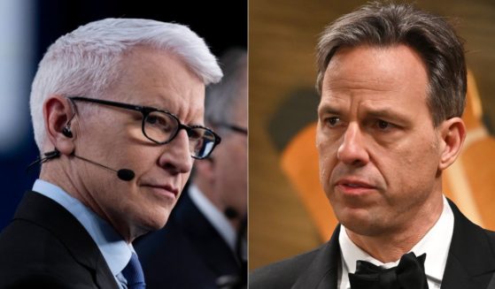 During a Sunday meeting, CNN employees - including Anderson Cooper, left, and Jake Tapper, right - were told to avoid covering President Donald Trump the way the network has in the past.