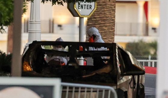 First responders wearing Hazmat gear investigate a Tesla Cybertruck that exploded in front of the entrance to the Trump International Hotel & Tower Las Vegas on January 1, 2025 in Las Vegas, Nevada.