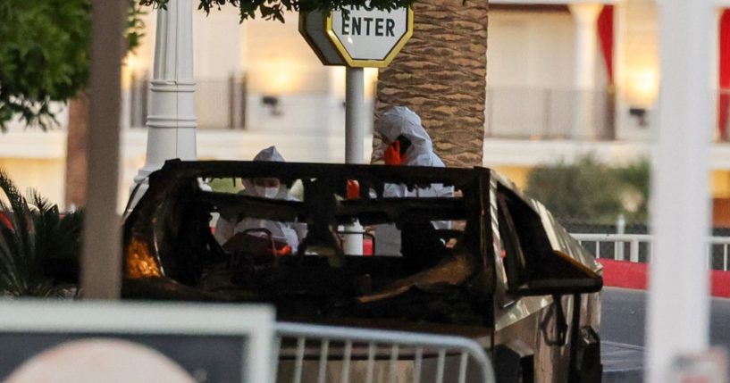 First responders wearing Hazmat gear investigate a Tesla Cybertruck that exploded in front of the entrance to the Trump International Hotel & Tower Las Vegas on January 1, 2025 in Las Vegas, Nevada.