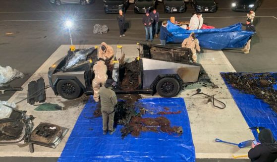 Investigators inspect the Tesla Cubertruck used in a bombing outside Trump Hotel in Las Vegas on Wednesday.