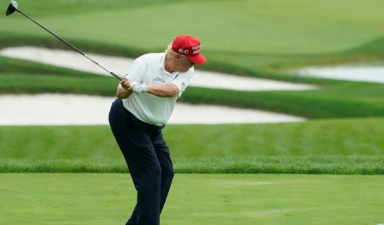 Donald Trump plays golf during the Official Pro-Am Tournament ahead of the LIV Golf Invitational Series event at Trump National Golf Club Bedminster in Bedminster, New Jersey, on Aug. 10.