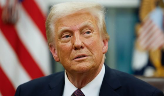 President Donald Trump signs executive orders in the Oval Office of the White House in Washington, D.C., on Monday.