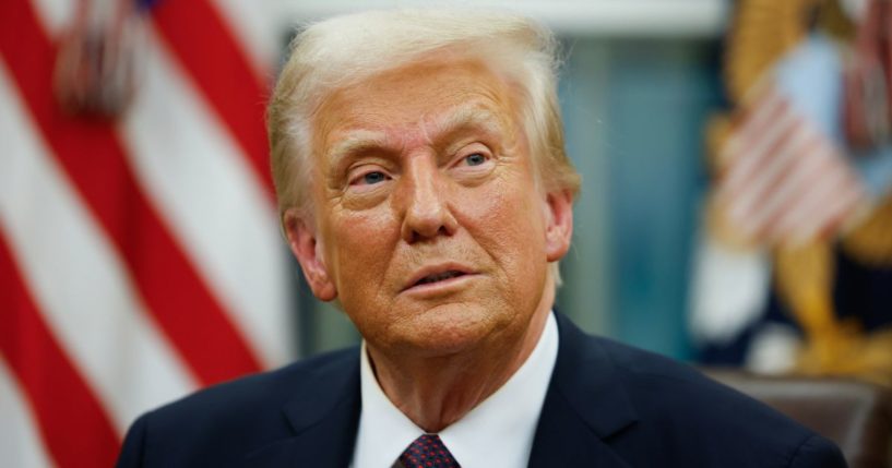 President Donald Trump signs executive orders in the Oval Office of the White House in Washington, D.C., on Monday.