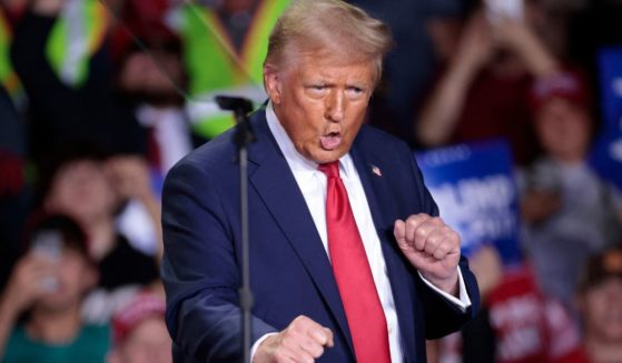 Then-Republican presidential candidate Donald Trump Donald Trump dances as he arrives to speak during his final campaign rally in Grand Rapids, Michigan, on Nov. 5.