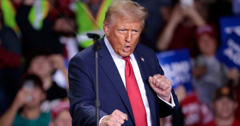 Then-Republican presidential candidate Donald Trump Donald Trump dances as he arrives to speak during his final campaign rally in Grand Rapids, Michigan, on Nov. 5.