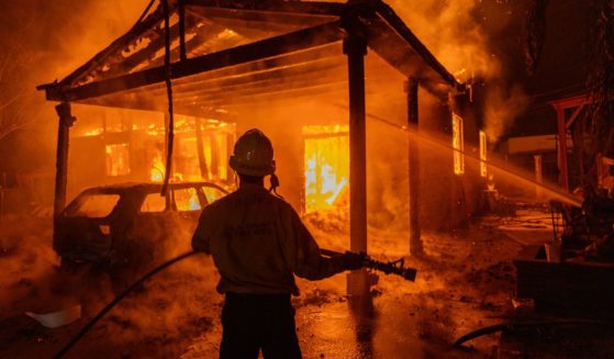 Firefighters battle the Eaton Fire in Altadena, California, on Wednesday.