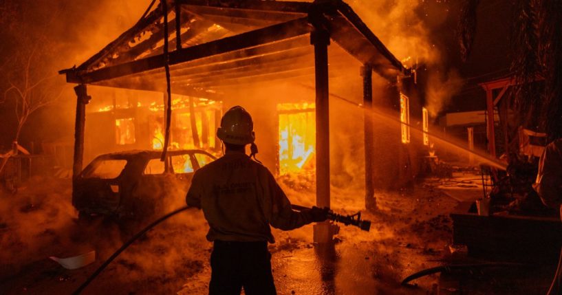 Firefighters battle the Eaton Fire in Altadena, California, on Wednesday.