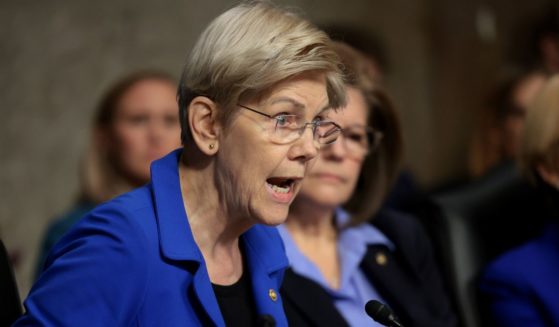 Senate Finance Committee member Sen. Elizabeth Warren begins yelling while questioning Health and Human Services Secretary nominee Robert Kennedy Jr. during his confirmation hearing in Washington, D.C., on Wednesday.