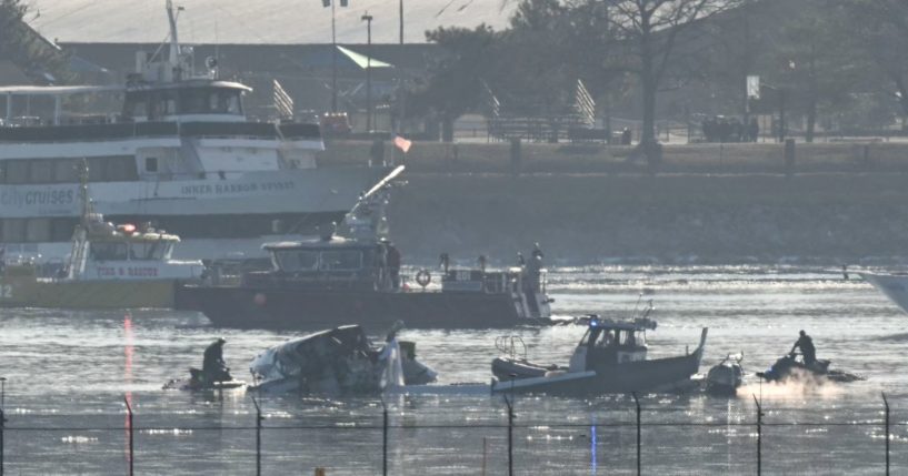 Part of the wreckage is seen on Thursday morning as rescue crews search the waters of the Potomac River after a passenger plane collided with a Black Hawk helicopter on approach to Reagan National Airport on Wednesday night.