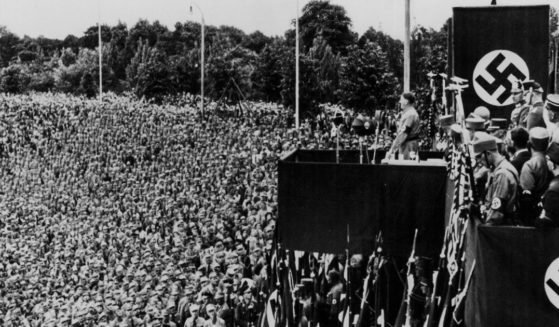 Adolph Hitler addresses a crowd of uniformed men at a Nazi rally in Dortmund, Germany in 1933.