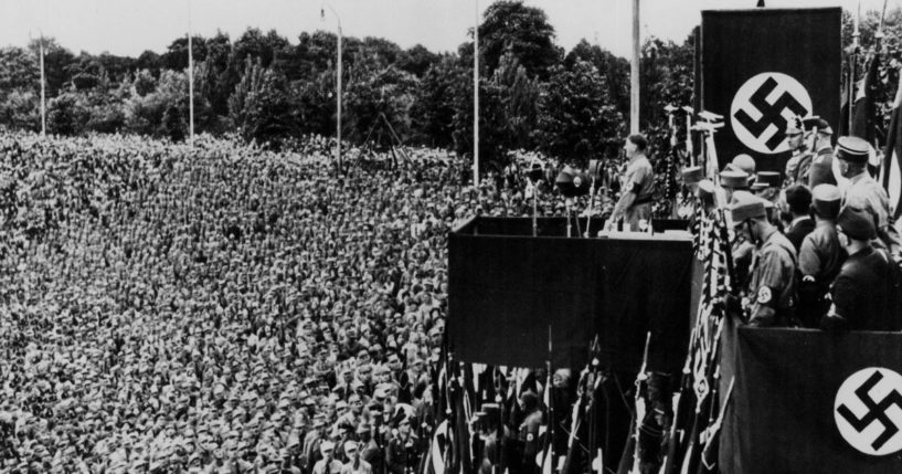 Adolph Hitler addresses a crowd of uniformed men at a Nazi rally in Dortmund, Germany in 1933.