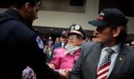 Protesters with the group CodePink demonstrate at the start of the Senate Armed Services confirmation hearing Tuesday for President-elect Donald Trump's nominee for Secretary of Defense Pete Hegseth on Capitol Hill in Washington, D.C.