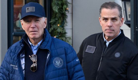 President Joe Biden, left, and son Hunter Biden, right, step out of a bookstore while shopping in Nantucket, Massachusetts, on Nov. 29.