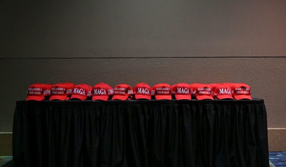 MAGA hats are placed on a table for supporters of President-elect Donald Trump and Ohio Sen. J.D. Vance at an election night party at the Palm Beach County Convention Center in West Palm Beach, Florida on November 5, 2024.