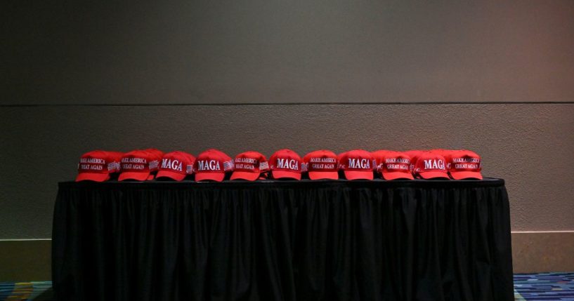 MAGA hats are placed on a table for supporters of President-elect Donald Trump and Ohio Sen. J.D. Vance at an election night party at the Palm Beach County Convention Center in West Palm Beach, Florida on November 5, 2024.