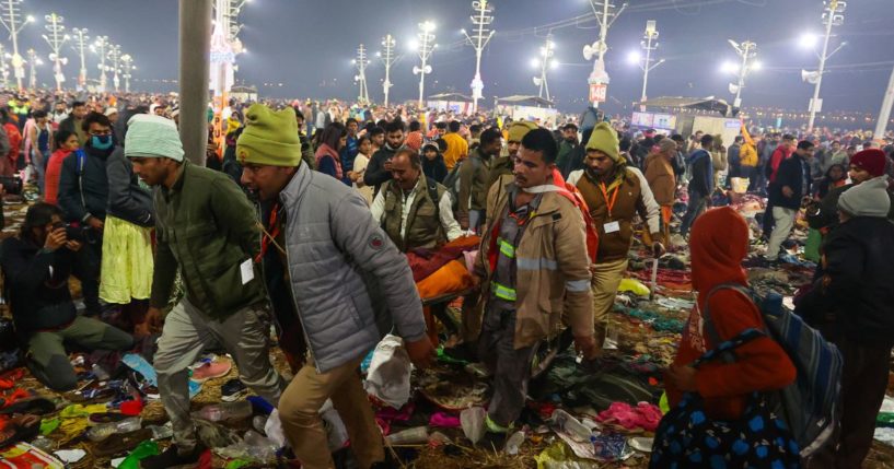 An attendee is carried away after a stampede before the "Amrit Snan" at the Kumbh Mela in Allahabad, India, on Wednesday.