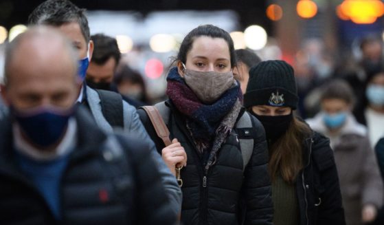 Commuters wear face masks in London, England, on Nov. 30, 2021.