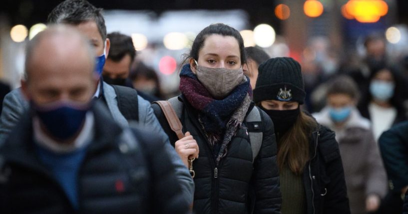 Commuters wear face masks in London, England, on Nov. 30, 2021.