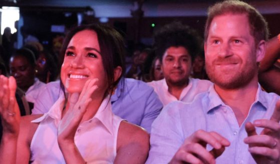 Meghan, Duchess of Sussex, left, and Prince Harry attend the Afro-Descendant Women and Power: Voice of Equity in Cali, Colombia, on Aug. 18.