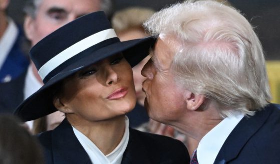 Melania Trump kisses then-President-elect Donald Trump as he arrives for the inauguration ceremony in the U.S. Capitol Rotunda in Washington, D.C., on Monday.