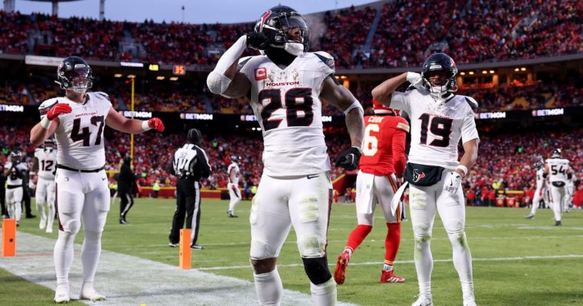 Joe Mixon, center, of the Houston Texans celebrates after scoring a touchdown against the Kansas City Chiefs during the third quarter in the AFC Divisional Playoff in Kansas City, Missouri, on Saturday.