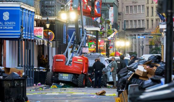 Police investigators surround the pick-up truck that drove through Bourbon Street in New Orleans, Louisiana, killing 15 and injuring 30 on Wednesday.