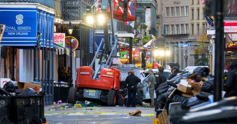 Police investigators surround the pick-up truck that drove through Bourbon Street in New Orleans, Louisiana, killing 15 and injuring 30 on Wednesday.