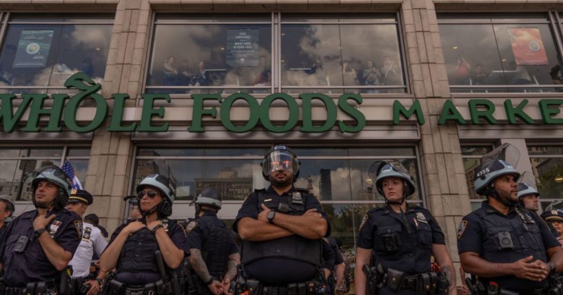 NYPD officers stand guard during a protest at Union Square in New York City on Sept. 2.