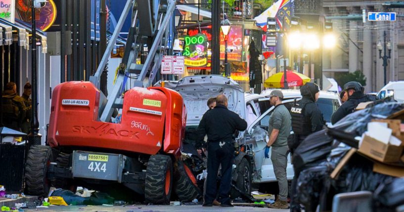 Police investigators surround a white truck that drove into the New Year's Eve festivities on Bourbon Street in the French Quarter of New Orleans, Louisiana, on Wednesday.