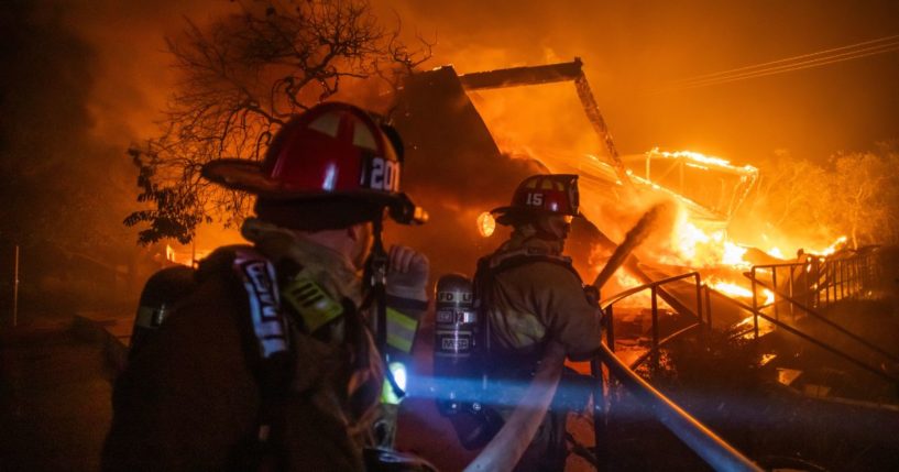 Firefighters fight the flames from the Palisades Fire burning in the Pacific Palisades neighborhood of Los Angeles, California, on Wednesday.