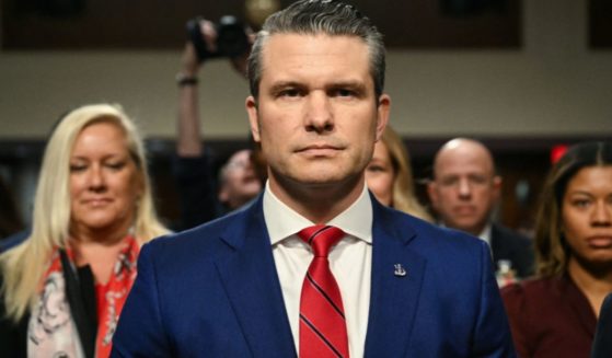 Pete Hegseth, President-elect Donald Trump's nominee for Defense Secretary, takes his seat as he arrives for his confirmation hearing before the Senate Armed Services Committee on Capitol Hill in Washington, D.C., on Tuesday.