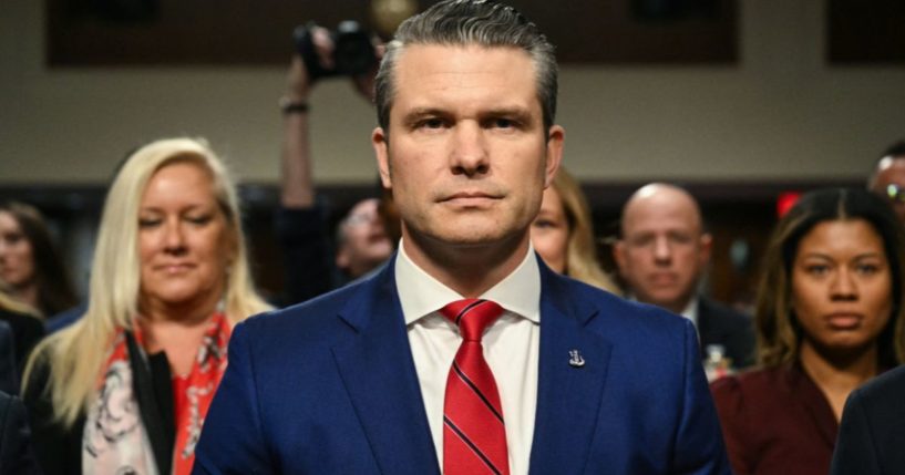 Pete Hegseth, President-elect Donald Trump's nominee for Defense Secretary, takes his seat as he arrives for his confirmation hearing before the Senate Armed Services Committee on Capitol Hill in Washington, D.C., on Tuesday.