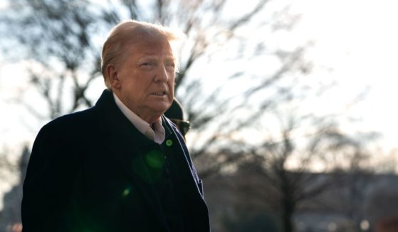 U.S. President Donald Trump speaks to members of the press as he and first lady Melania Trump prepare to depart the White House aboard Marine One on January 24, 2025 in Washington, DC.