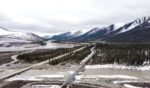 An aerial view of the Dalton Highway and Trans-Alaska Pipeline crossing over the Dietrich River on May 10, 2024 about 19 miles northeast of Wiseman, Alaska.