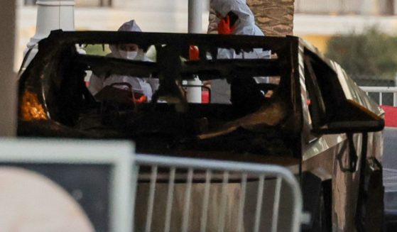 First responders wearing Hazmat gear investigate a Tesla Cybertruck that exploded in front of the entrance to the Trump International Hotel & Tower Las Vegas on January 01, 2025 in Las Vegas, Nevada.