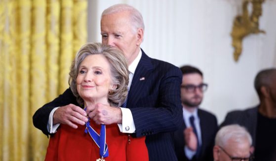 Former U.S. Secretary of State Hillary Clinton is awarded the Presidential Medal of Freedom by U.S. President Joe Biden in the East Room of the White House on January 4, 2025 in Washington, DC.