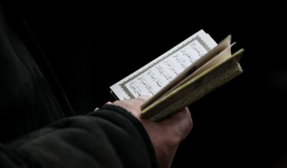 The Quran is read at a funeral in Baku, Azerbaijan, on Saturday.