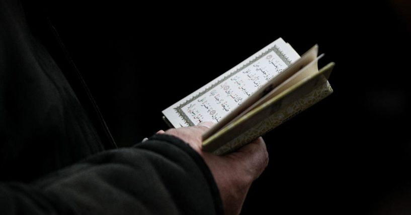 The Quran is read at a funeral in Baku, Azerbaijan, on Saturday.