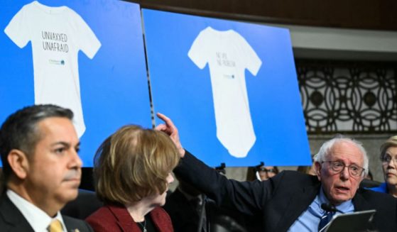 Sen. Bernie Sanders, an independent from Vermont, questions Robert F. Kennedy Jr. Wednesday during a Senate Finance Committee hearing on Kennedy's nomination to be Health and Human Services Secretary.