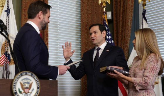 Vice President J.D. Vance, left, swears in Marco Rubio, center, as the secretary of State for the new Trump administration as Rubio's wife Jeanette Dousdebes Rubio, right,looks on at Eisenhower Executive Office Building in Washington, D.C., on Tuesday.