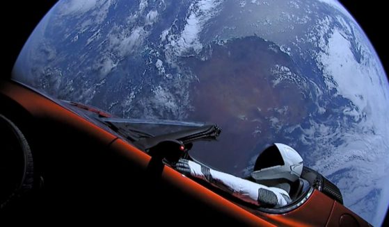 In this handout photo provided by SpaceX, a Tesla roadster launched from the Falcon Heavy rocket with a dummy driver named "Starman" heads towards Mars.