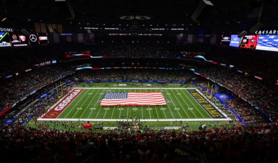 The American Flag is displayed at midfield during the National Anthem before the College Football Playoff Quarterfinal game between the Georgia Bulldogs and the Notre Dame Fighting Irish at the Allstate Sugar Bowl in New Orleans, Louisiana, on Jan. 2.