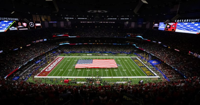 The American Flag is displayed at midfield during the National Anthem before the College Football Playoff Quarterfinal game between the Georgia Bulldogs and the Notre Dame Fighting Irish at the Allstate Sugar Bowl in New Orleans, Louisiana, on Jan. 2.