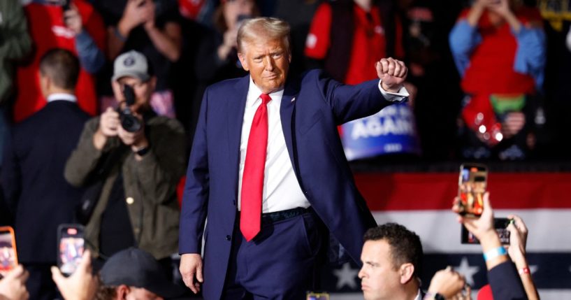 Now-President-elect Donald Trump gestures as he leaves after speaking at his last campaign rally in Grand Rapids, Michigan, on Nov. 5.