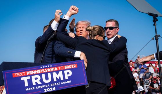 Donald Trump stands up and encourages the crowd after an assassination attempt at a campaign rally in Butler, Pennsylvania, on July 13.