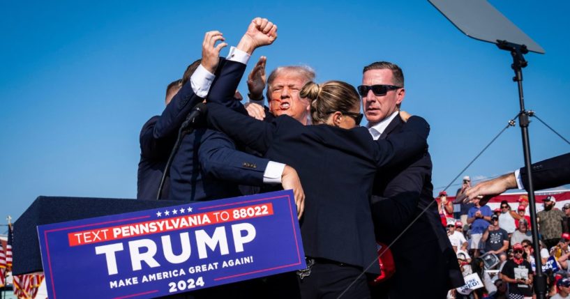 Donald Trump stands up and encourages the crowd after an assassination attempt at a campaign rally in Butler, Pennsylvania, on July 13.