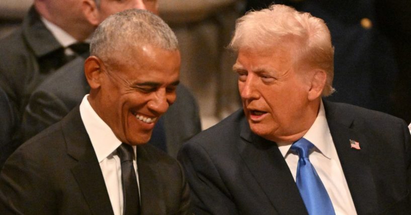 Former President Barack Obama, left, and President-elect Donald Trump, right, speak before the funeral service for former President Jimmy Carter in Washington, D.C., on Thursday.