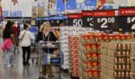 Shoppers at the Walmart Supercenter shop during Walmart's multi-week Annual Deals Shopping Event in Burbank, California, on Nov. 21.